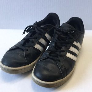 Black adidas three striped shoes